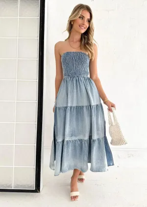 Denim strapless tiered maxi dress with a gathered bodice, side slit, and patchwork hem